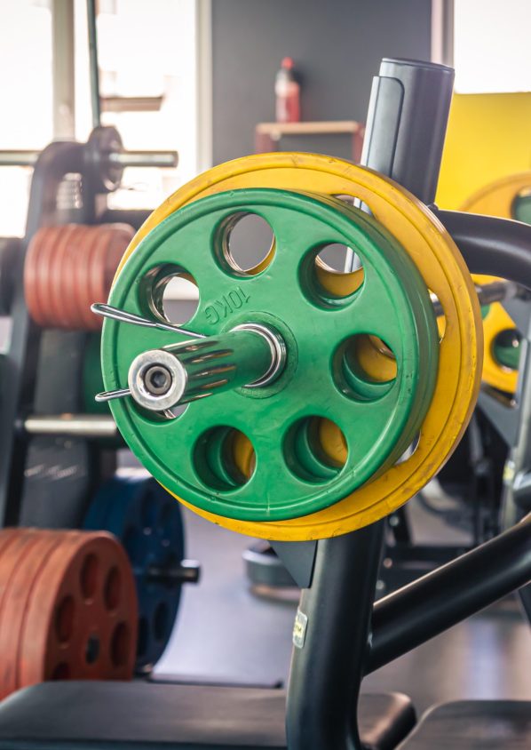 Fitness equipment such as barbell, weight plates, various colors for various bench press and dumbbell positions.